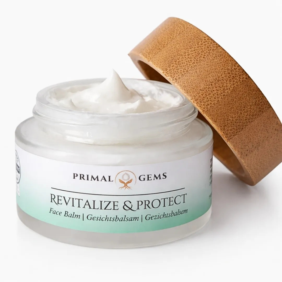 Primal Gems Revitalize & Protect tallow face balm in frosted glass jar with bamboo lid and multilingual label.