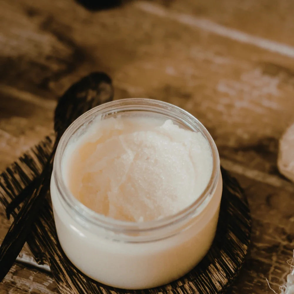 A glass jar filled with homemade beef tallow balm, showcasing a simple, natural skincare preparation.